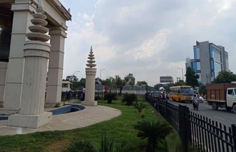Surajpur_a city street with a train on the tracks